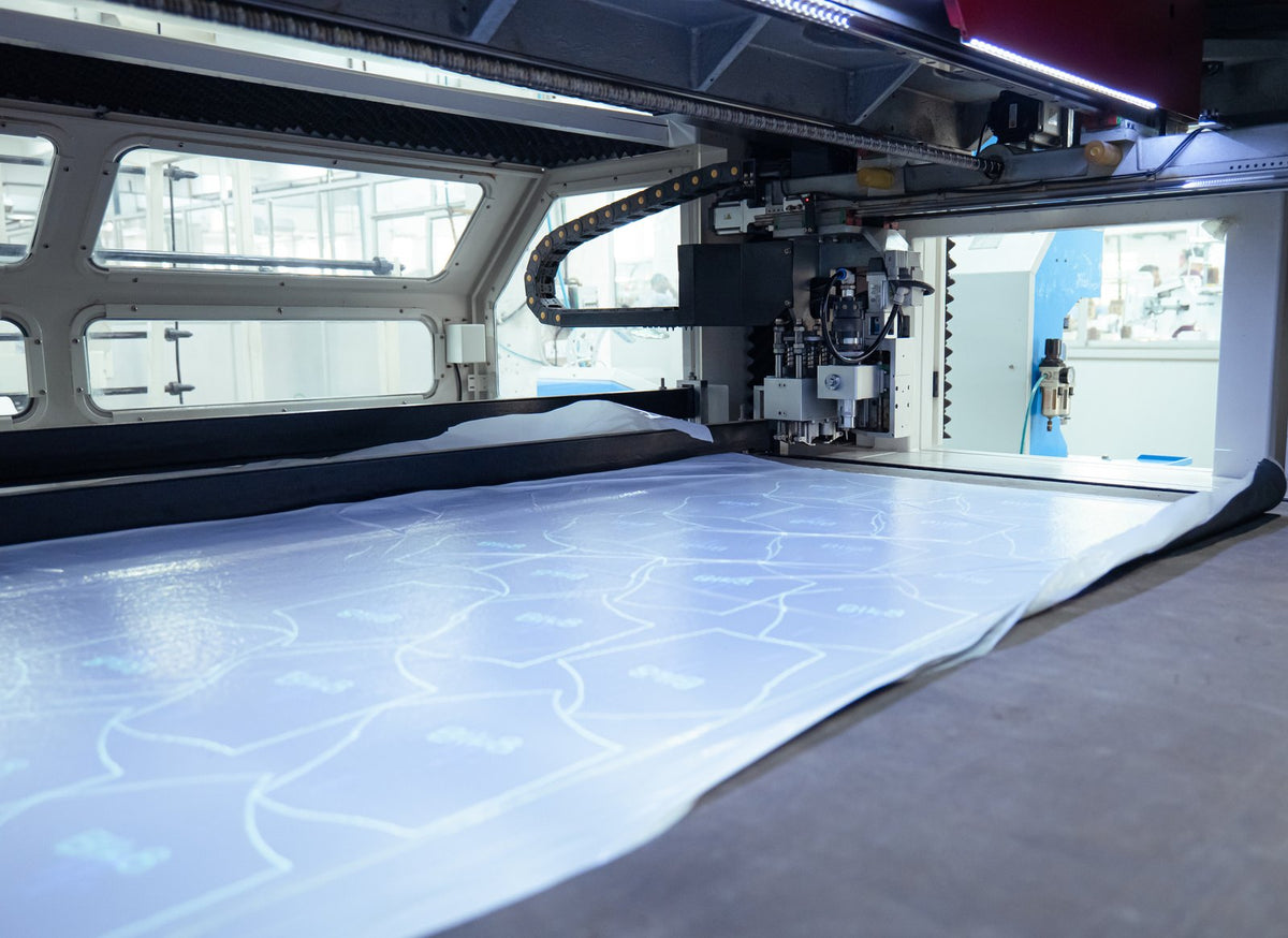 Digital patterns laid out across the material on an automatic cutting bed