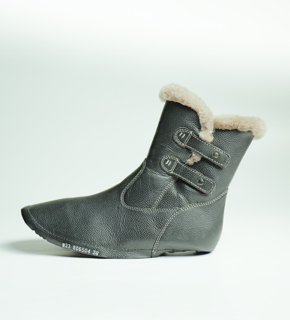 A lamb fur trimmed leather upper, ready for lasting