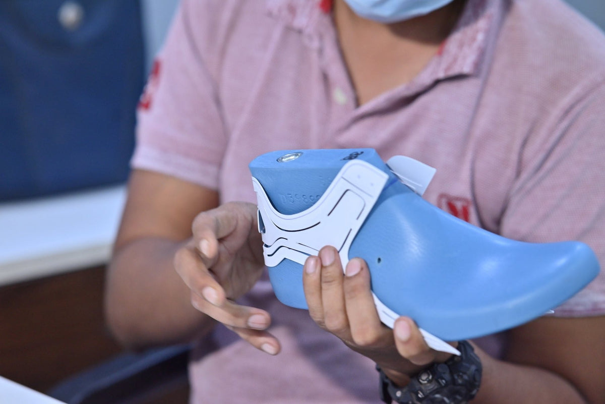 A footwear last and pattern pieces under review during development