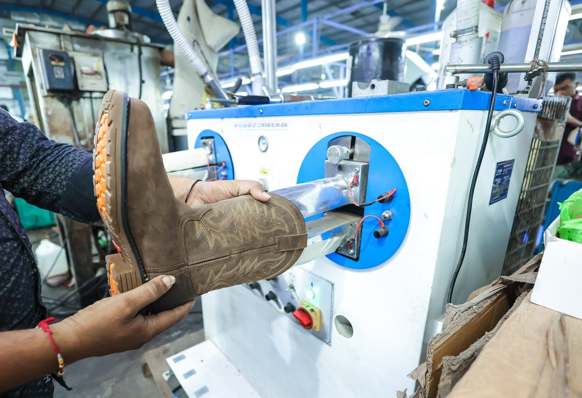 A lug sole pressed onto a lasted boot