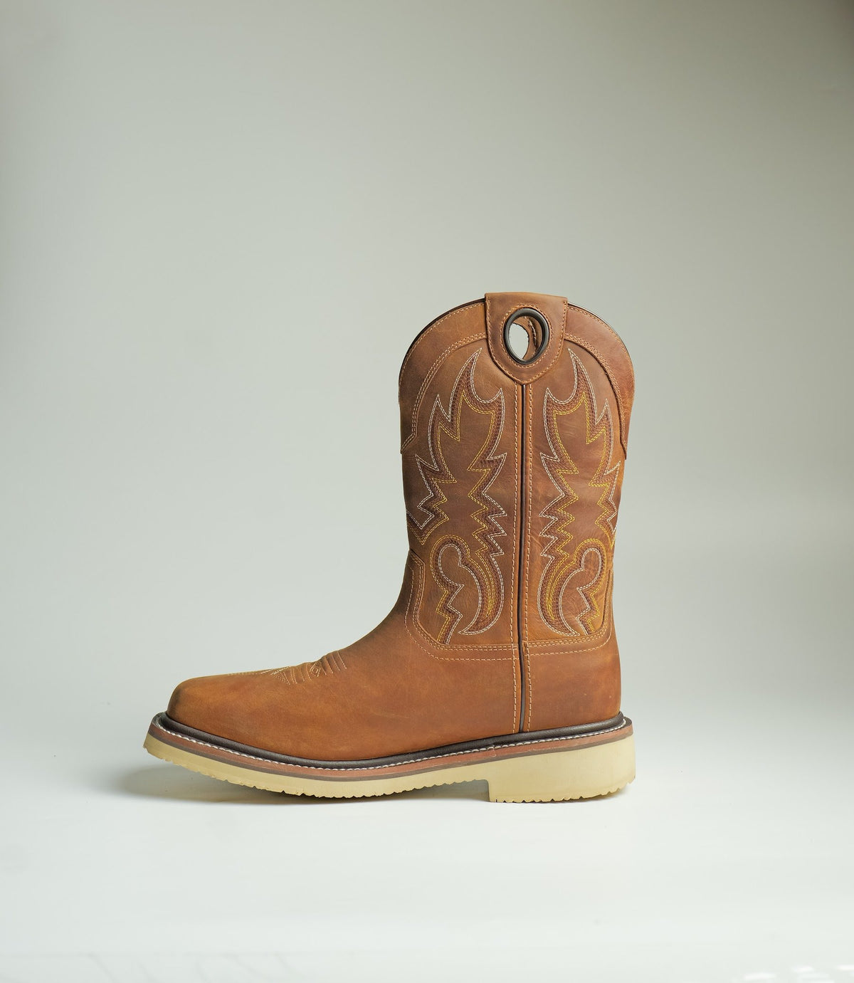 A pull-on work boot with a stitched shaft