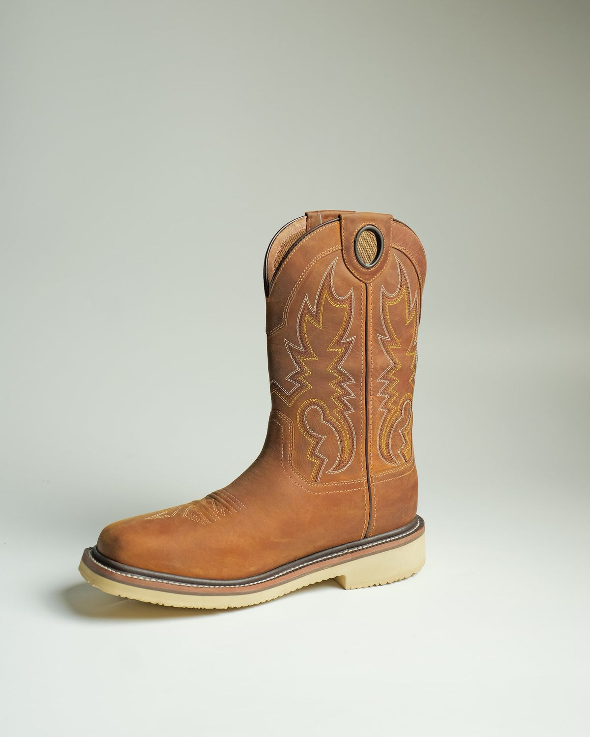 A pull-on work boot with a wedge sole