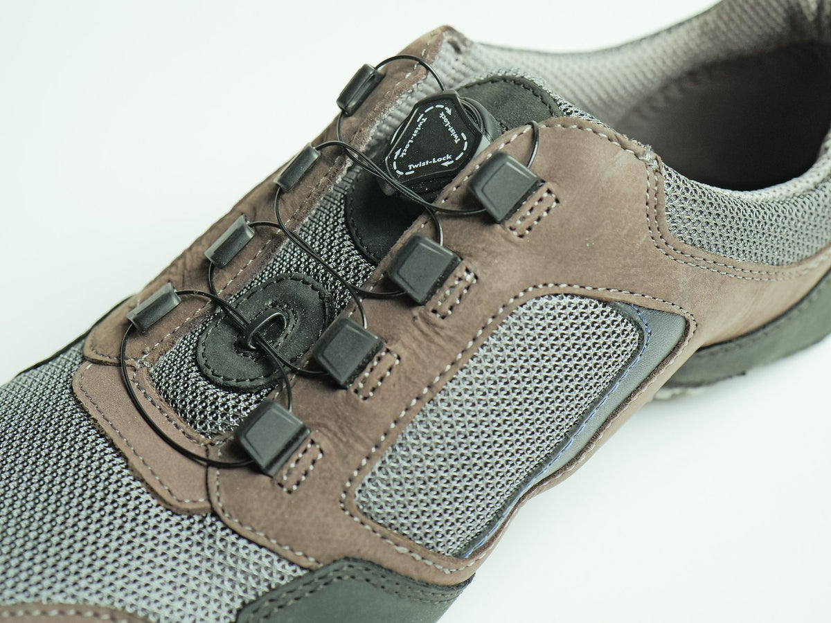 A suede and mesh upper with a dial-operated auto-lacing closure and cable guides