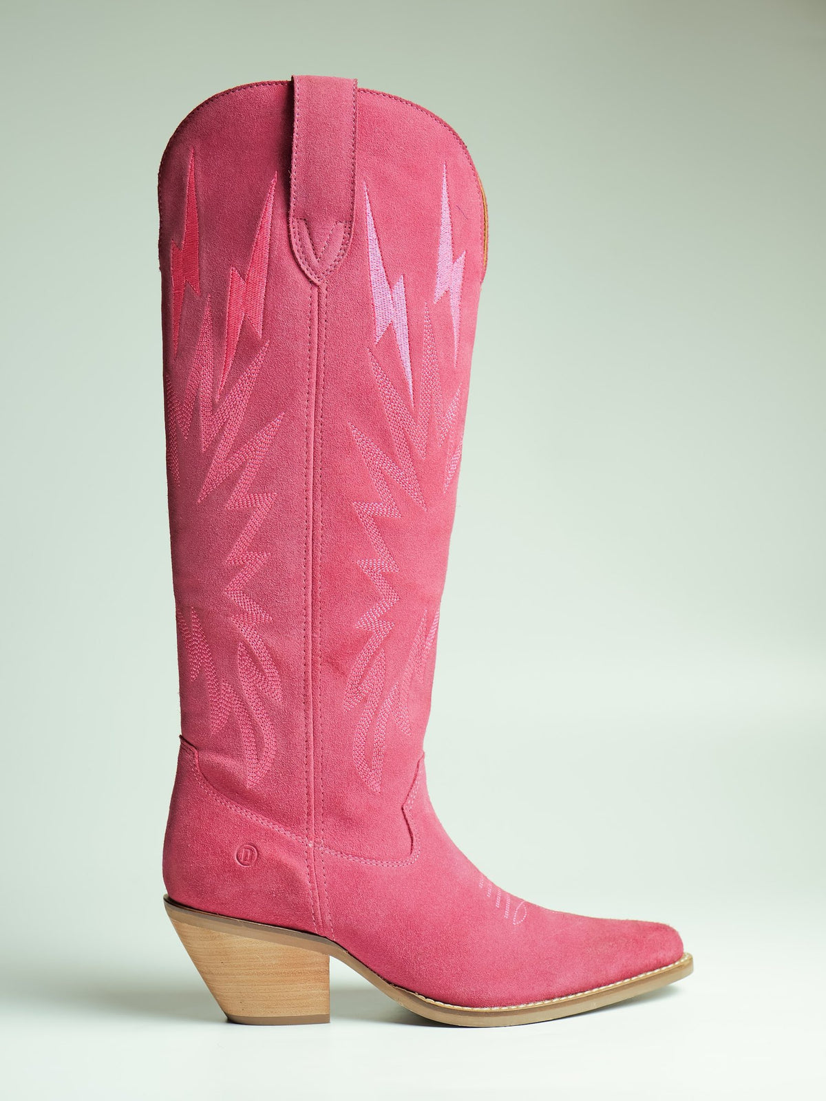 A tall pink suede women’s Western boot, made by AFPL