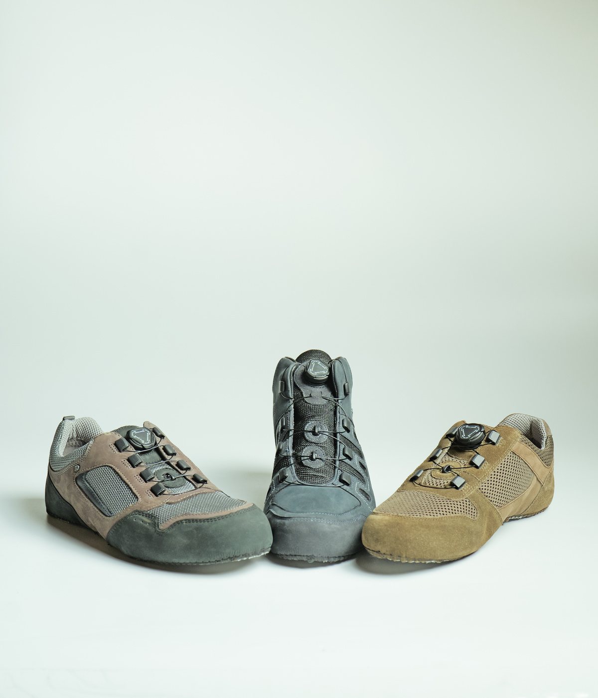 Three suede and mesh shoes with dial-operated auto-lacing closures