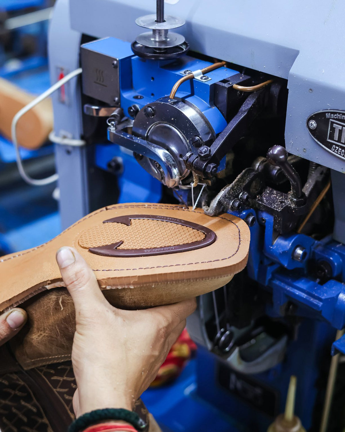 A welted Western boot sole at the sole-stitching machine on our line