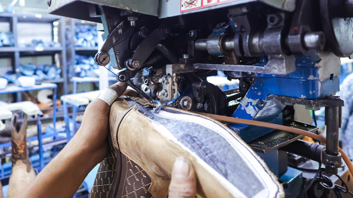 A Western boot guided through a Goodyear welting machine at AFPL
