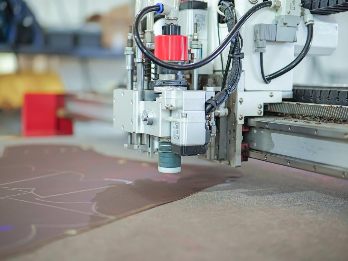 A dieless cutting head cutting upper components on the AFPL line