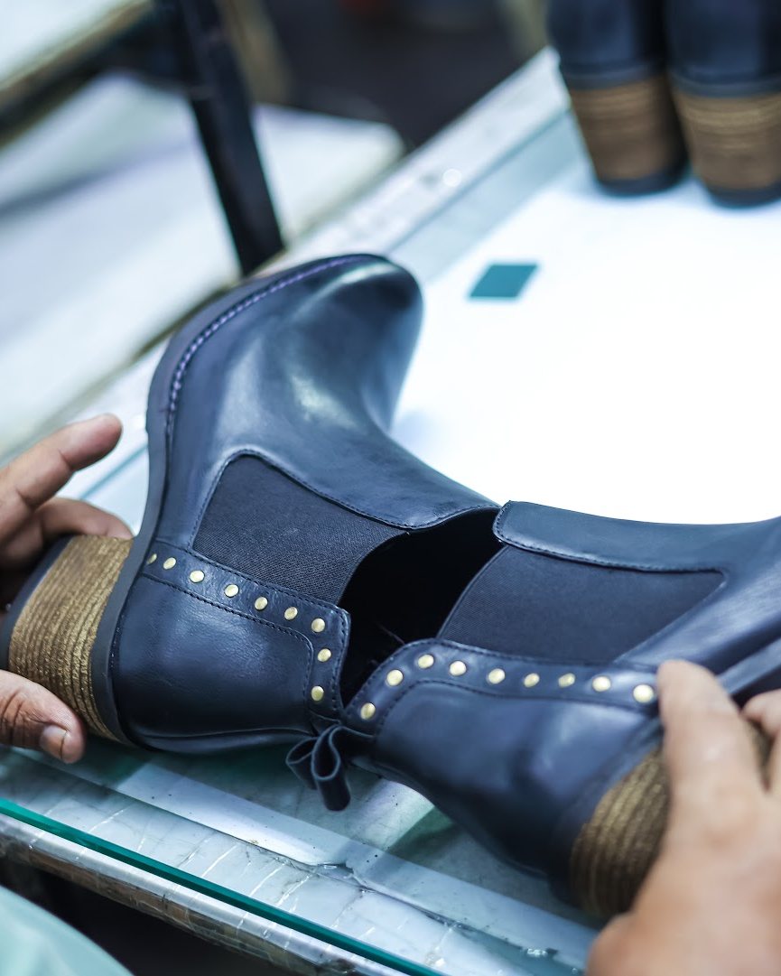 A fashion boot checked on the AFPL line