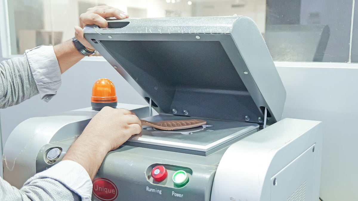 A footwear material sample placed in a laboratory analyser