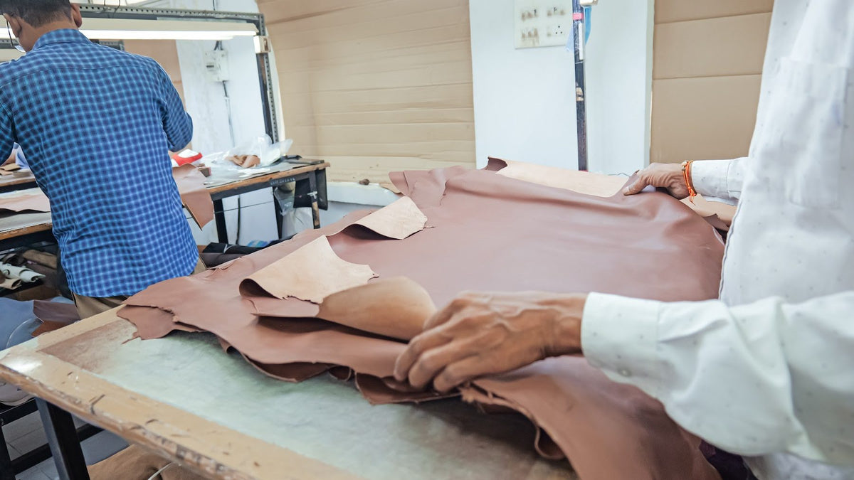 Hides laid out and checked by hand on the AFPL inspection table