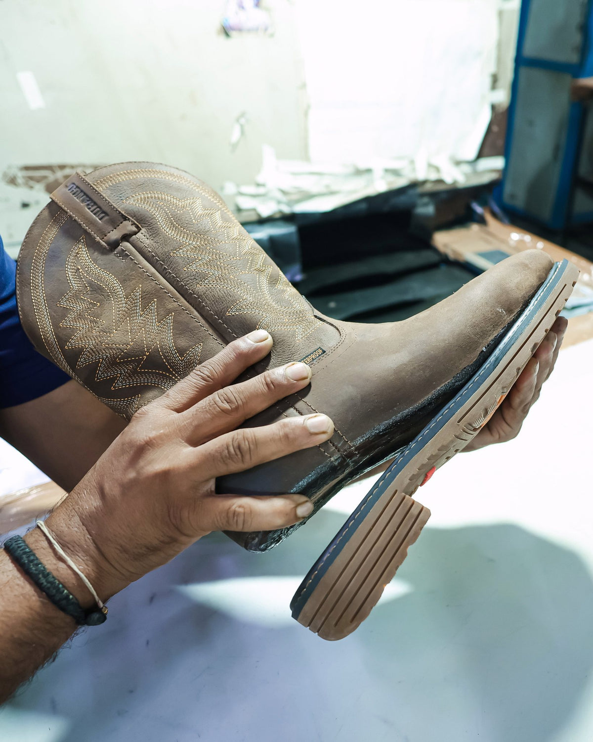 A lasted Western boot with its bonded sole, checked on our line