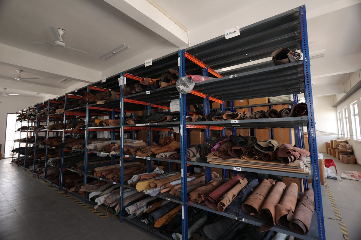 Leather stored on tall racks in the material store