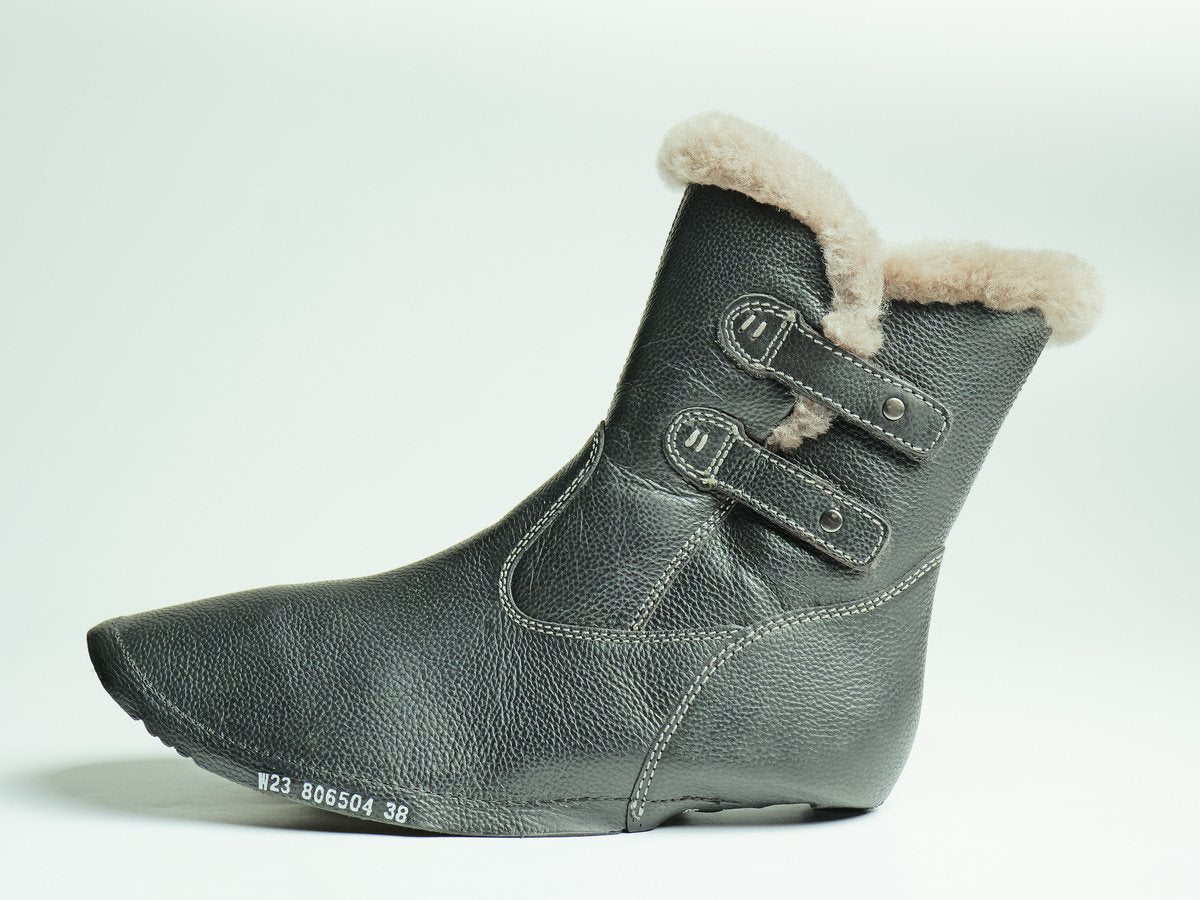 A leather upper lined with lamb fur, made by AFPL and ready for lasting