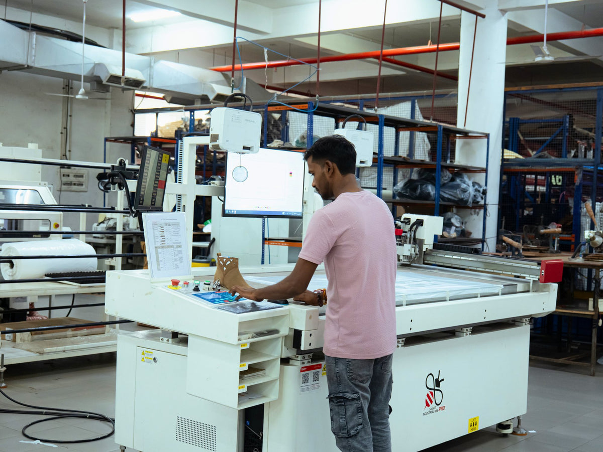 An operator at a dieless cutting machine