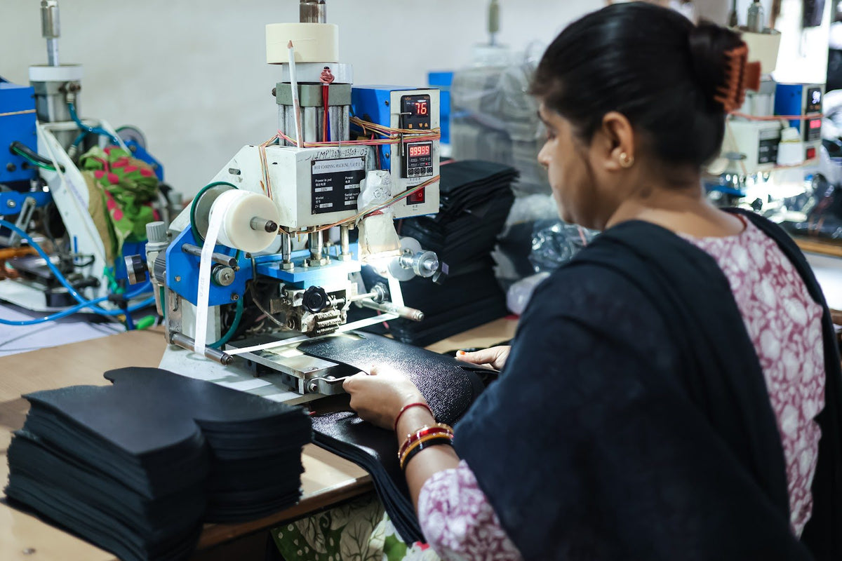 An operator preparing upper components at a machine