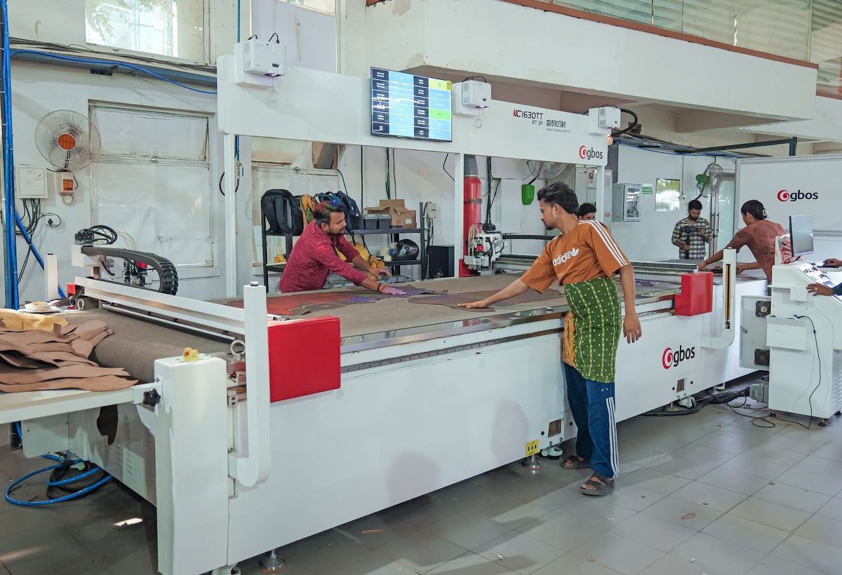 Operators at a dieless cutting table on the AFPL floor