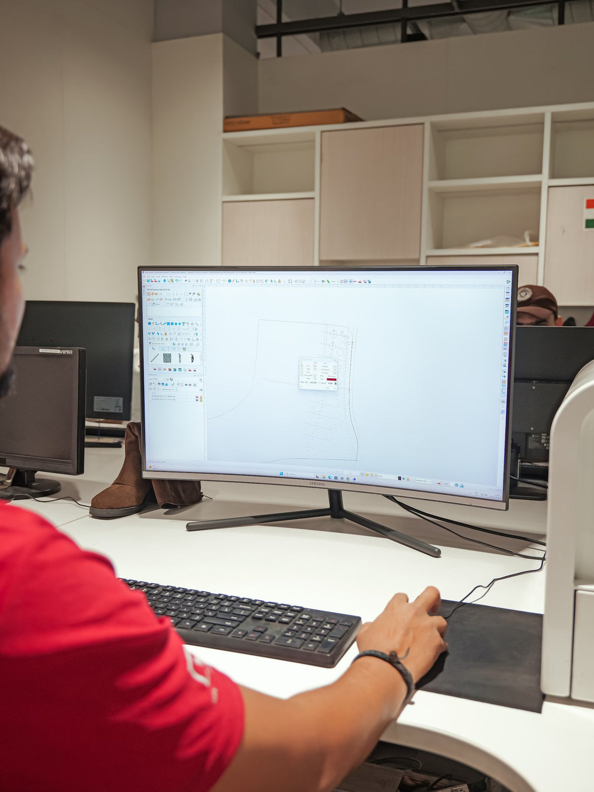 A pattern engineer developing a style in CAD in the AFPL Product Creation Centre