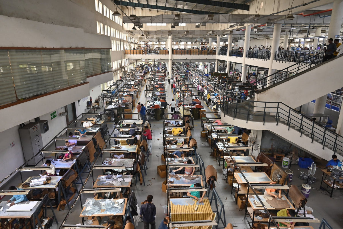 Teams at work on an AFPL production floor, seen from the mezzanine