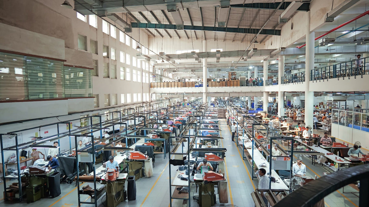 Production lines across a full AFPL factory floor, seen from the mezzanine