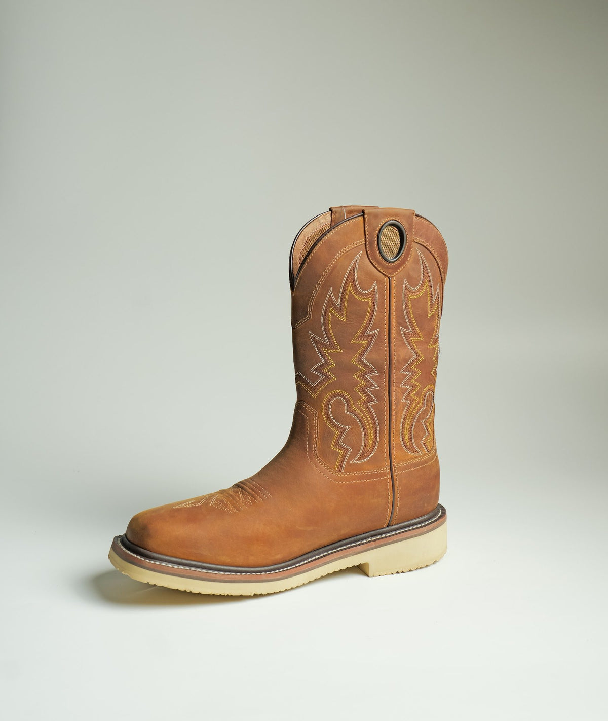 A pull-on work boot with a stitched shaft