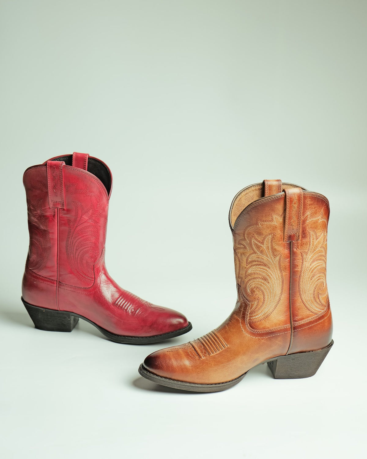Red and tan women’s Western boots with bonded soles, made by AFPL