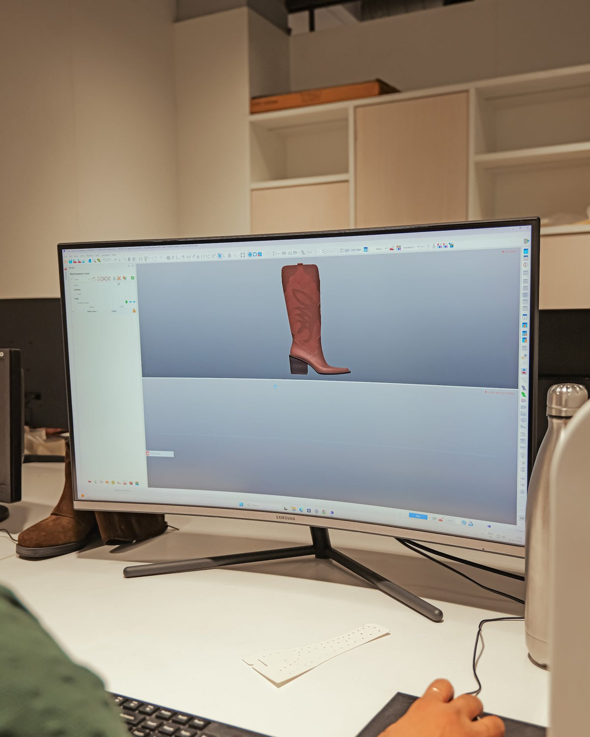 A tall boot modelled in 3D on a designer’s screen
