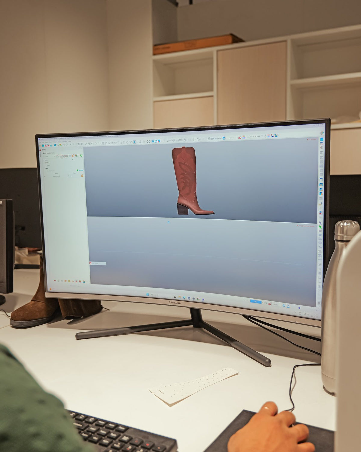 A tall boot modelled in 3D on a designer’s screen