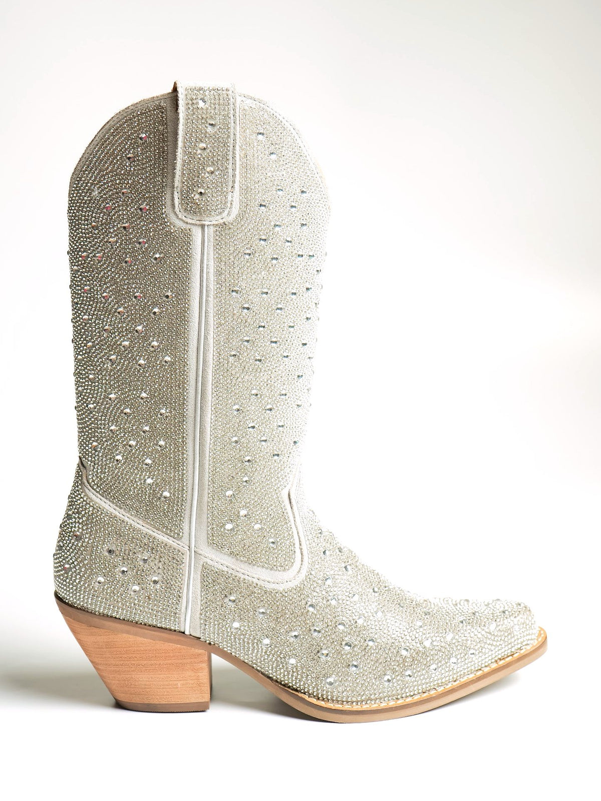 A tall grey suede Western boot studded with crystals