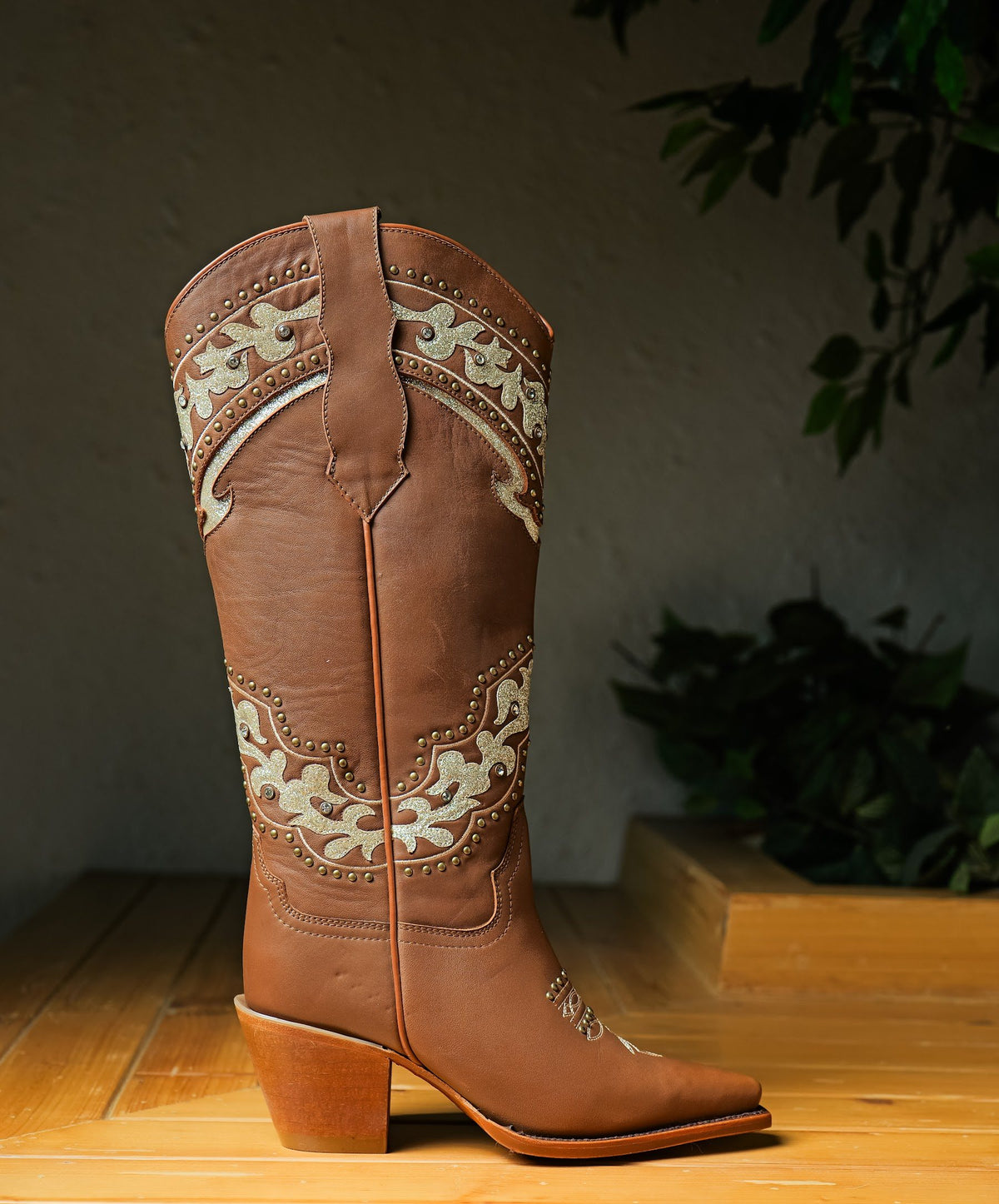 A tall tan Western boot with cream overlays on the shaft, Goodyear welted