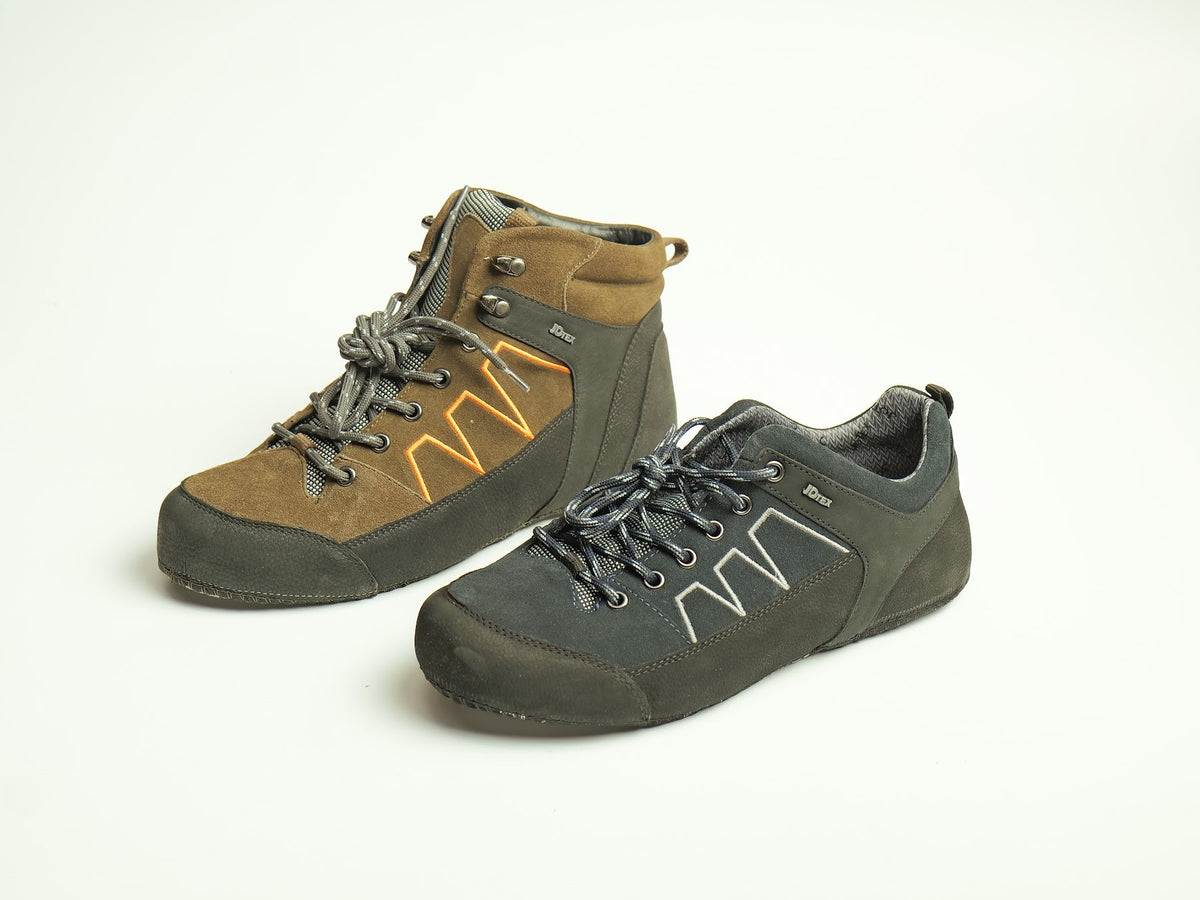 Two suede and leather uppers built into finished shoes by AFPL