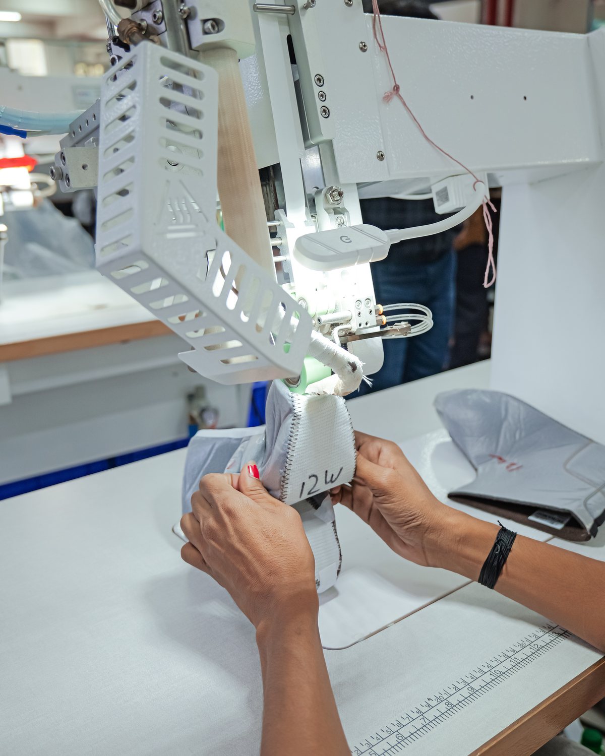 An upper joined to its insole on Strobel stitching machinery