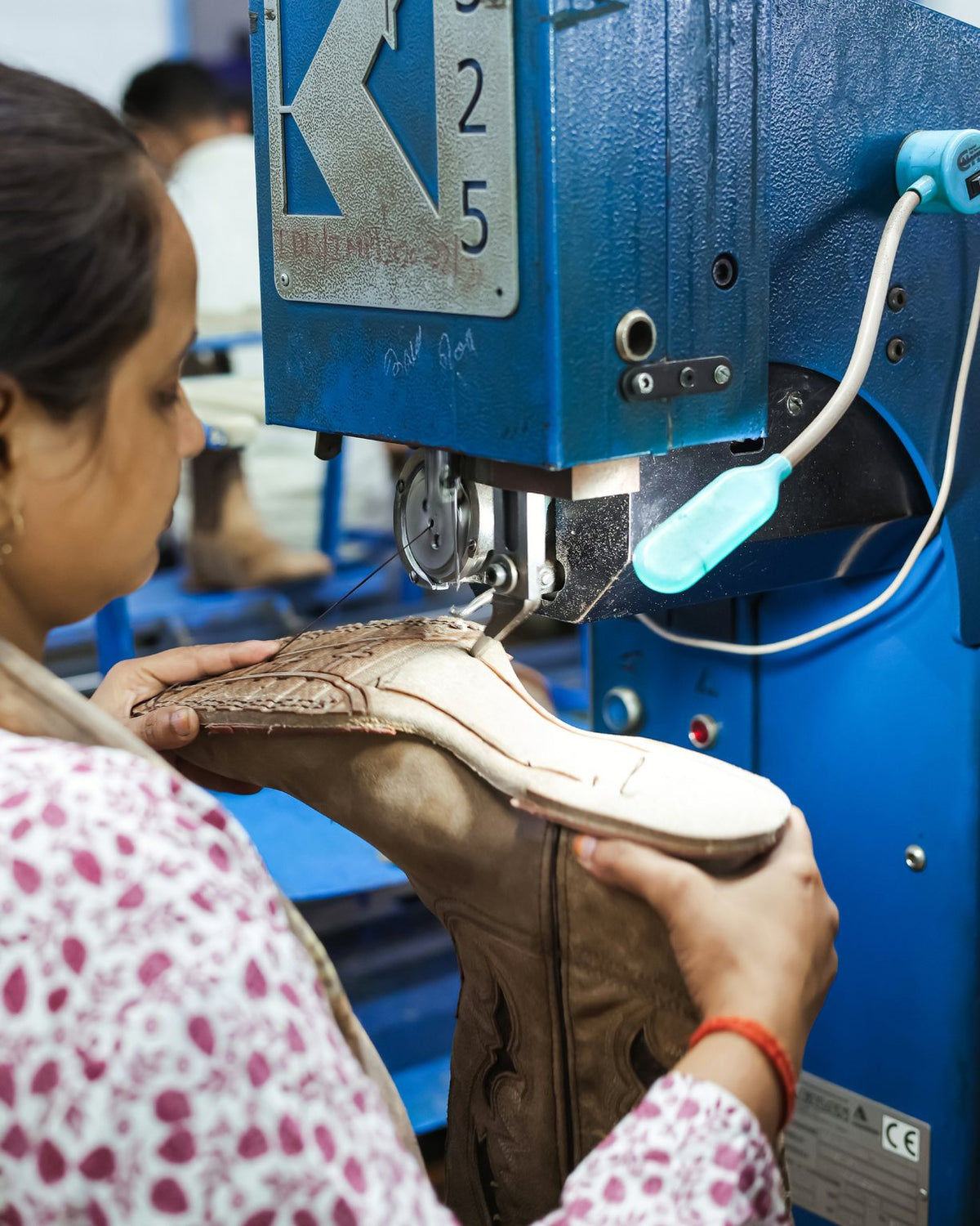 A Western boot at the Blake stitch machine on our line