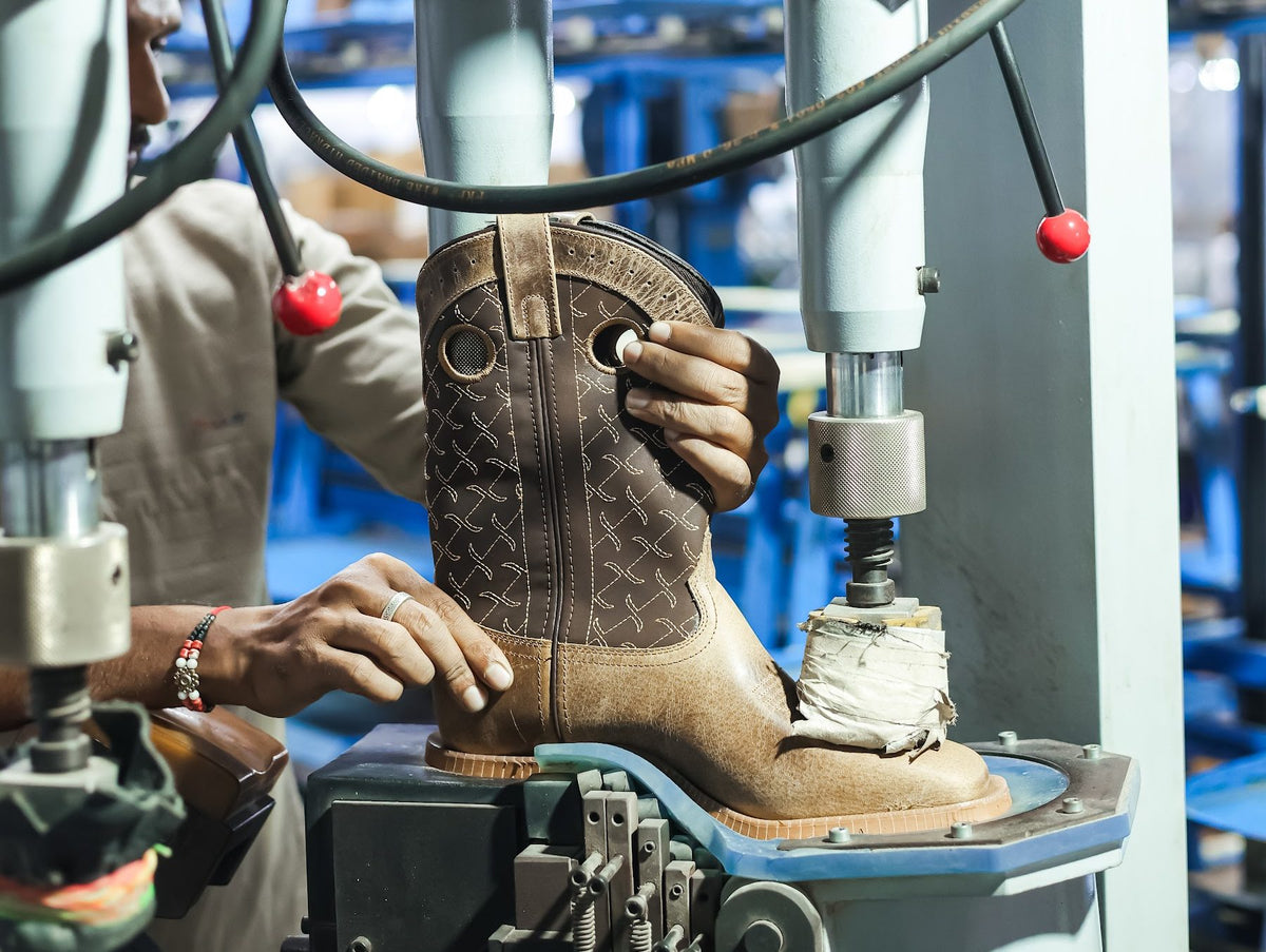 A Western boot on the last at a heel-seat lasting machine