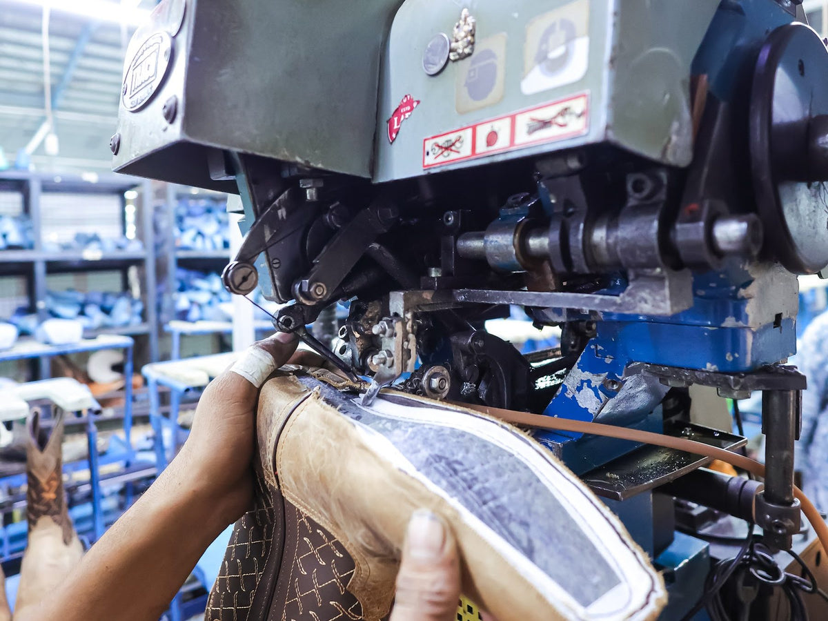A Western boot at a welt-attaching machine on the AFPL line